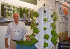 Laurens Trebes of Urban Ponics with vertical cultivation towers in the booth at Rovero